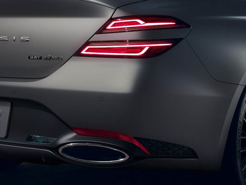 The exhaust and rear LED lighting in the 2022 Genesis G70, helping illustrate Performance Features in the 2022 Genesis G70